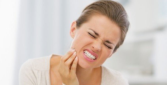 triệu chứng mọc răng khôn